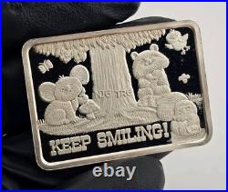1977 Keep Smiling Greathouse Productions 1oz. 999 Vintage Square Silver Bar