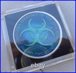1 oz. MORTUGA #4 Zombucks Colorized World Series round. 999 fine silver