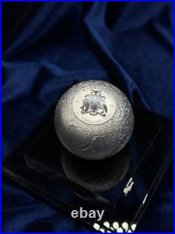 A spherical solid silver coin dedicated to Earth s satellite, the Moon