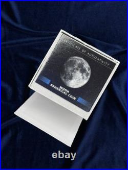 A spherical solid silver coin dedicated to Earth s satellite, the Moon