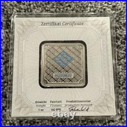 Geiger Edelmetalle Silver Bar 1oz Square in Plastic Assay Capsule Some Toning Geiger Edelmetalle Silver Bar 1oz Square in Plastic Assay Capsule Some Toning