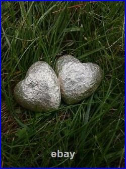 Hand poured and hammered 136/138 grams. 999 solid silver heart. Read info