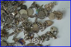 (ref165BO) 365g of assorted vintage solid silver charms and charm bracelets